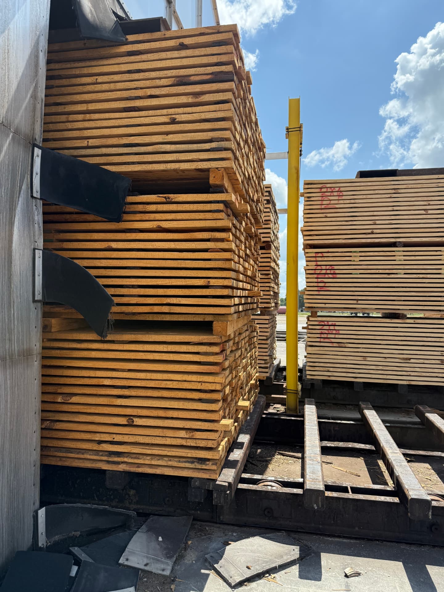 Kiln track carts and baffles staged for a lumber drying charge