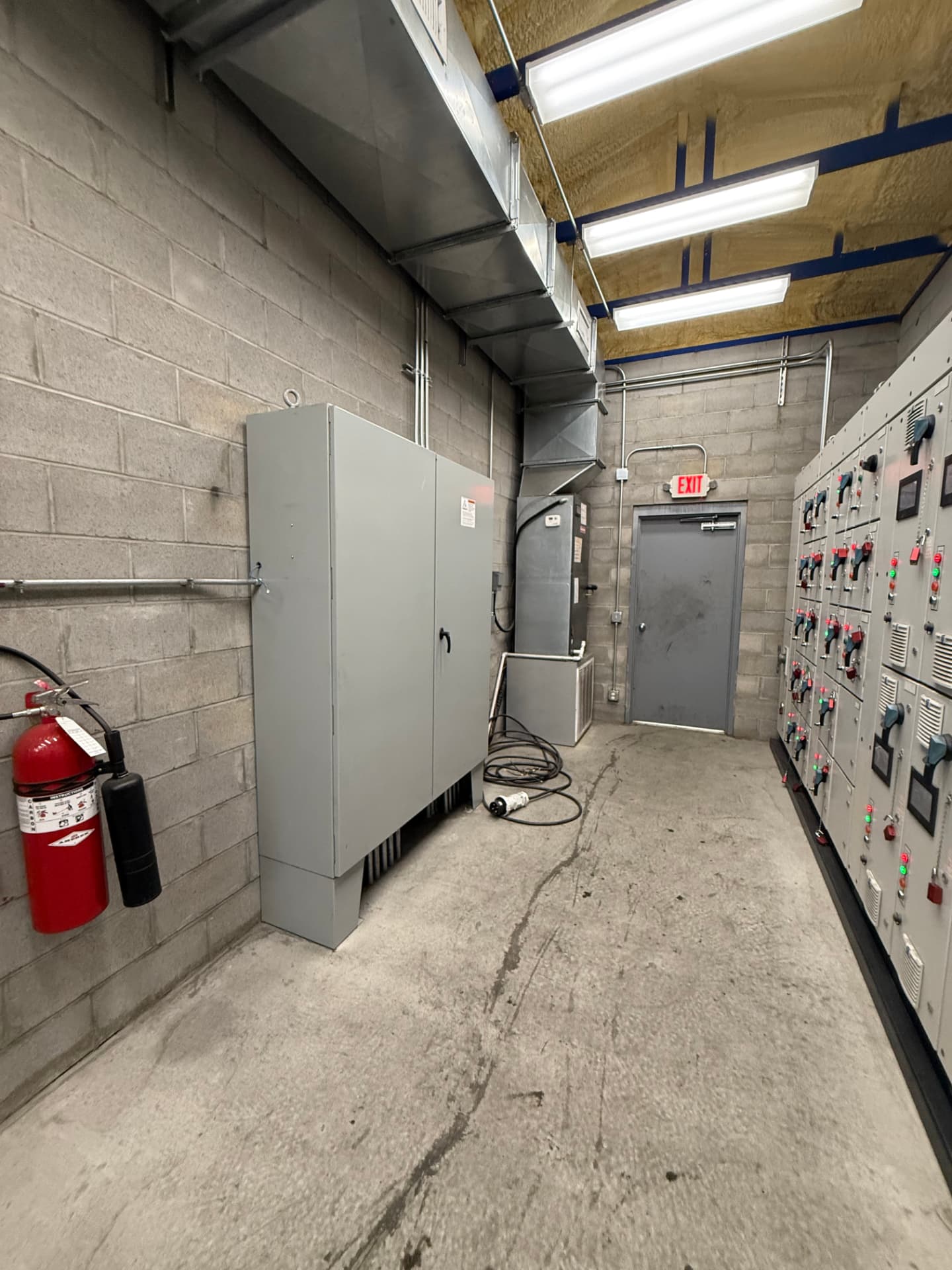 Kiln control room with MCC lineup, transformer, and control cabinets