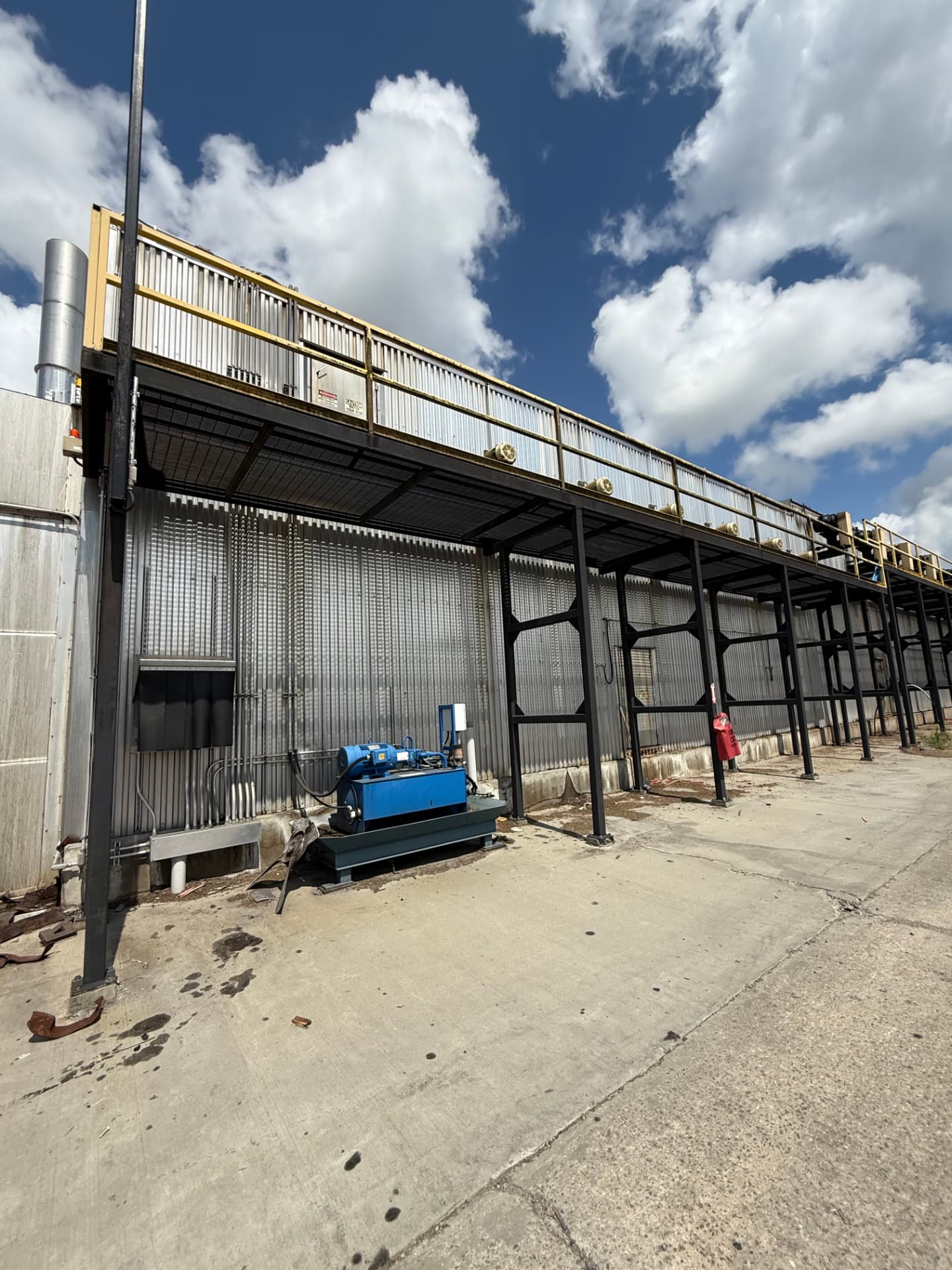 Kiln exterior catwalk and hydraulic power unit at a dry kiln