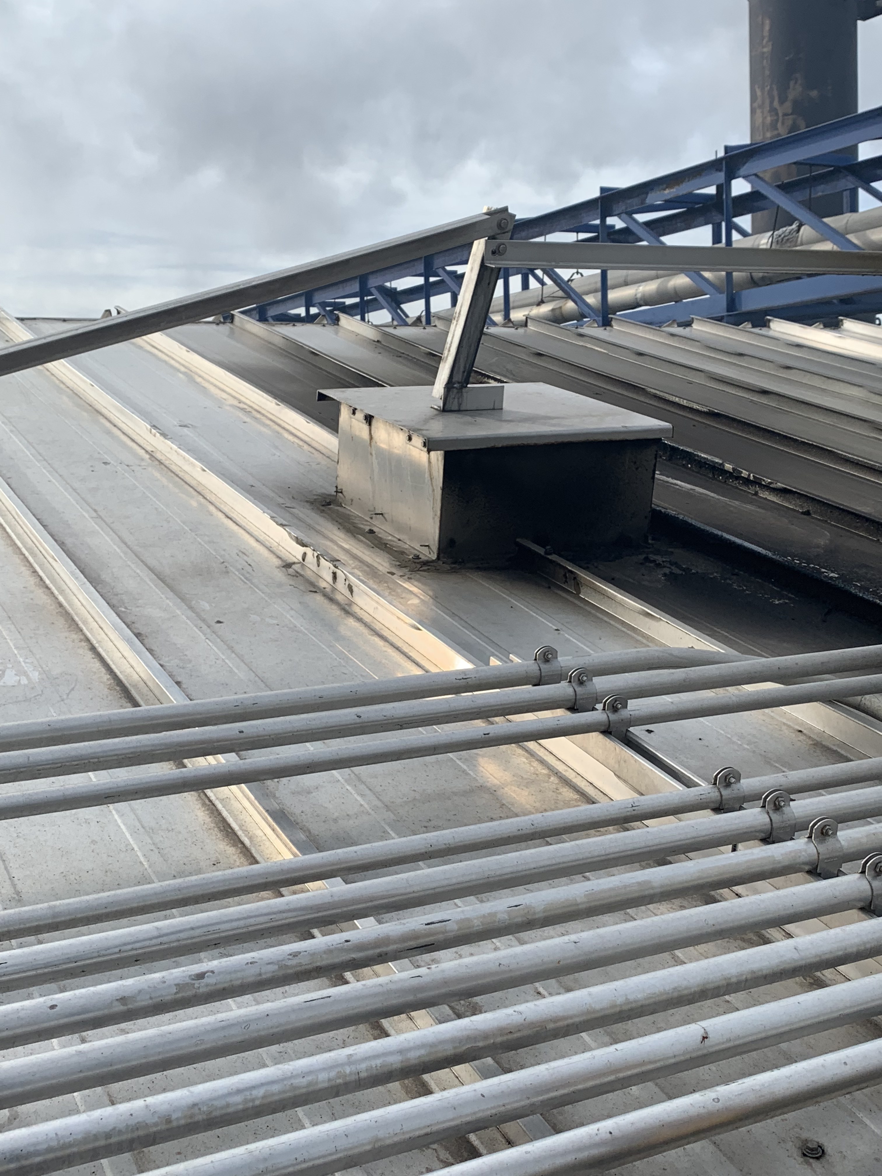 Dry kiln roof vents and electrical conduit runs on an aluminum kiln shell